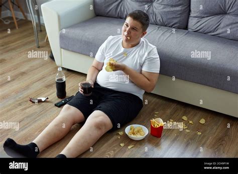 overweight child boy enjoy leading unhealthy passive lifestyle sits