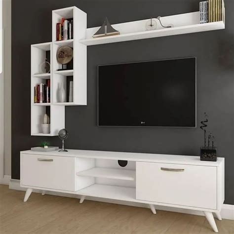 A White Entertainment Center With Bookshelves And A Television On It S