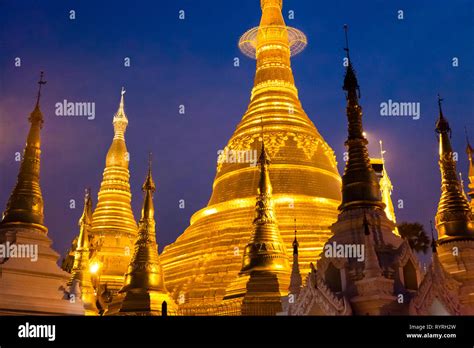 The Golden Minarets Of Schwedagon Pagoda At Night Myanmar Stock Photo