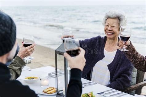 Mature Friends Drinking Wine At The Beach Stock Photo Image Of Group Dinner 118455342