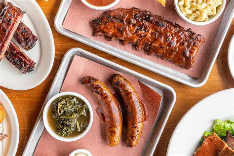 Barbeque Ribs And Sausage By Stocksy Contributor J Anthony Stocksy