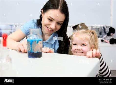 Little Scientist Curious Daughter Play With Mom Engaged At Education Activity Make Funny