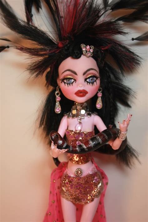 A Doll With Black Hair And Red Dress