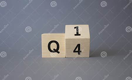 quarter  st symbol turned wooden cube  words