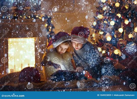 Amazed Children Using Tablet Near Christmas Tree Stock Image Image Of