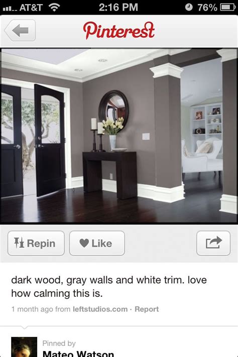 looooooove the grey with white trim and the dark door and furniture ...