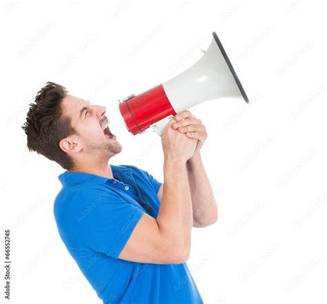 Man Screaming Into Bullhorn While Pointing Away Stock Adobe Stock