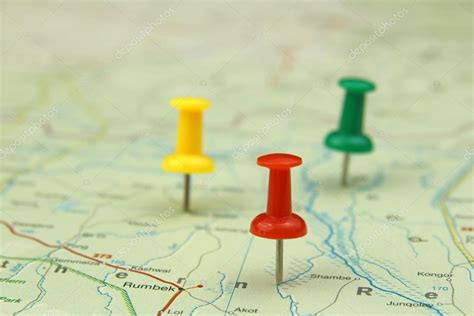 Colorful push pins on a road map Stock Photo by ©chrupka 25357797