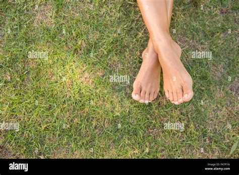 Barefoot in the grass Stock Photo - Alamy