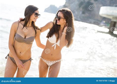 Women at the beach stock photo. Image of summer, body - 70474700 