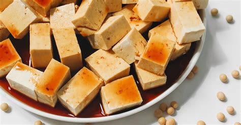 Sliced Tofu With Soy Sauce on White Ceramic Plate · Free Stock Photo