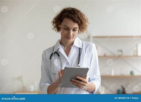 Female Doctor Consult Patient Online On Tablet Stock Photo Image Of