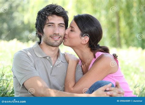 Kiss on the cheek stock image. Image of hair, close, female - 29064089