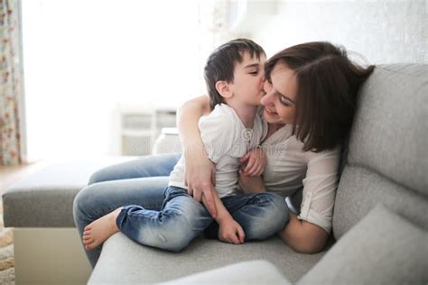Beautiful Brunette Mom And Son Hugging Sofa Stock Image Image Of Concept Lifestyle 122789329