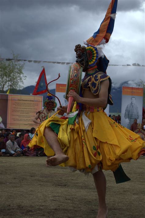 Nga Ging dancers wearing wrathful mask while playing the drums. | Mandala Collections - Images