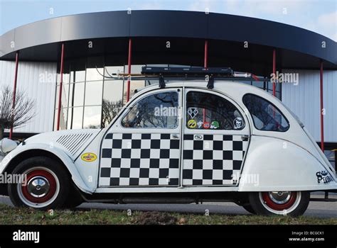 Chequered Citroen Deux Chevaux Parked By Roadside Stock Photo Alamy