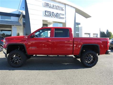 With a red lifted 2014 gmc sierra in the drive way!! 2014 Gmc Sierra ...