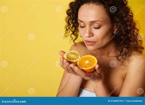 Beauty Portrait Of Attractive Curly Half Naked Woman Enjoying Citrus