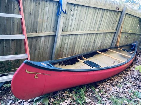 Old Town Charles River Red Royalex Canoe With Oars Person