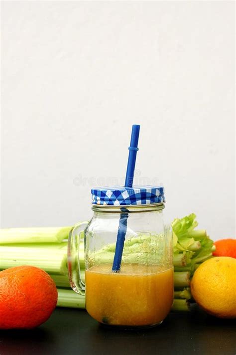 Healthy Fresh Smoothie Drink From Green Celery Lemon And Mandarin