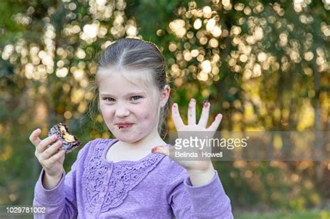 Three Young Australian Girls Hanging Out Together Laughing And Eating