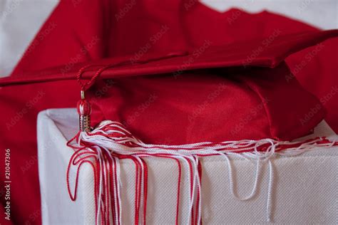 Red Graduation Cap and Gown Stock Photo | Adobe Stock