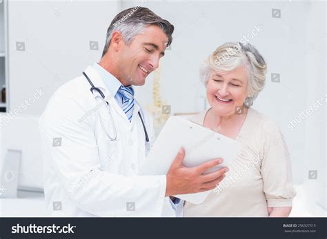 Happy Doctor Patient Discussing Over Reports Stock Photo 256327315 | Shutterstock