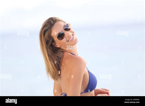 Blond Woman In Bikini With Eyeglasses Posing By The Beach Stock Photo Alamy
