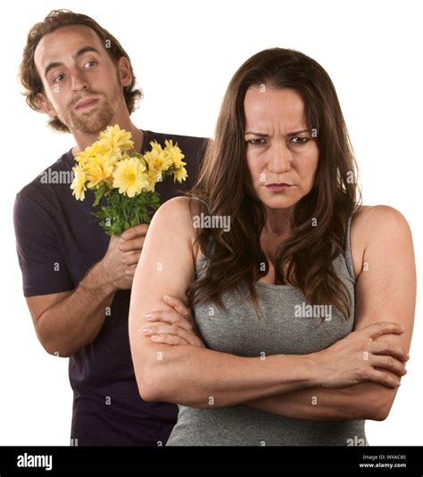 Angry Young Woman And Man With Flower Bouquet Stock Photo Alamy