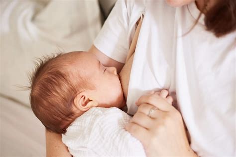 Premium Photo Mother Breastfeeding Her Newborn Baby Boy Realistic