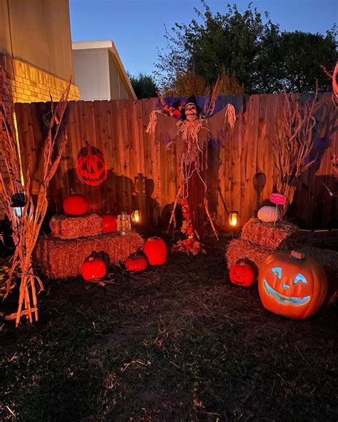 Yard Pumpkin Patch With Scarecrow In 2024 Halloween Yard Displays