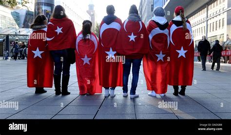 Seven Turkish women dressed in Turkish flags pose during a ...