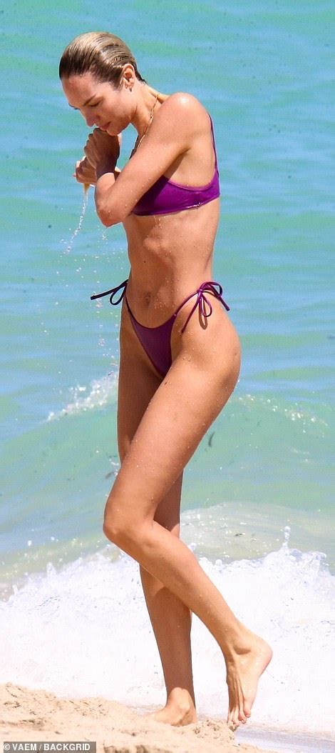 Candice Swanepoel Sends Temperatures Soaring In A Purple String Bikini