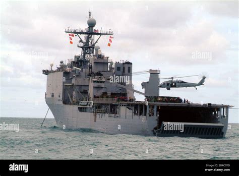 Us Navy An Mh 60s Seahawk Lands On The Flight Deck Of The Amphibious Dock Landing Ship Uss