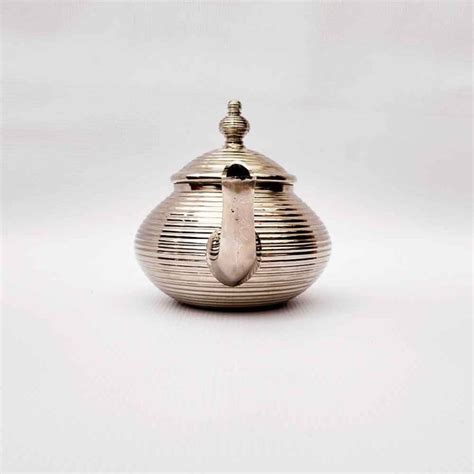 Handmade Teapots With Modern Designs In Silver And Gold