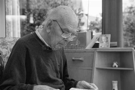 95 Years Old English Man Sitting In Chair In Domestic Environment