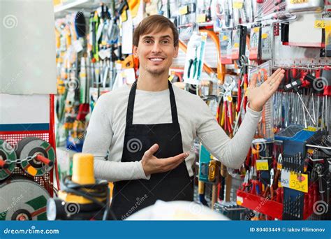 Professional Young Positive Salesman Working And Smiling Stock Image