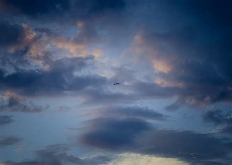 Airplane Flying at Sunset · Free Stock Photo