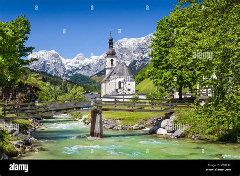 Scenic Mountain Landscape In The Bavarian Alps With Famous Parish