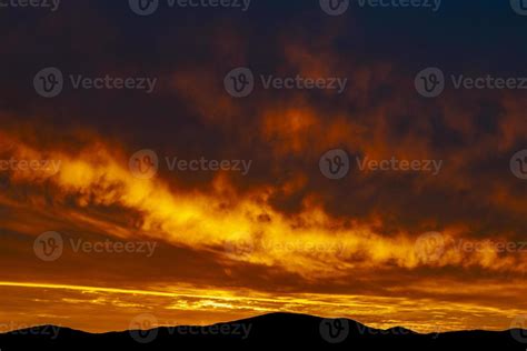 The beautiful colors of the clouds during sunrise over hills in silhouette 15192109 Stock Photo ...