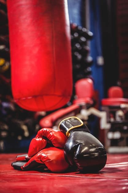 Premium Photo | Boxing gloves and punching bag