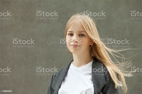 Closeup Outdoor Portrait Of A 13 Year Old Blonde Teenage Girl Stock