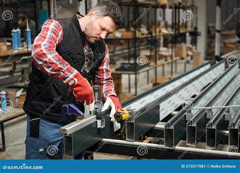 Adult Male Assembling Metal Structure In Workshop Stock Image Image Of Chief Glove 273577081