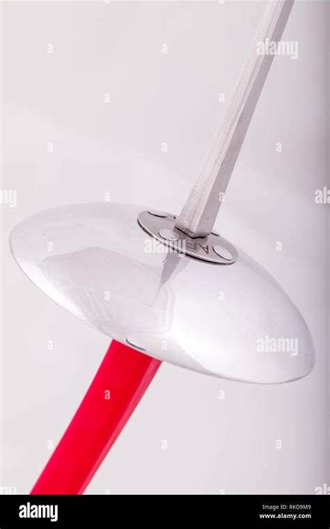 closeup of a foil sword with a red handle Stock Photo - Alamy