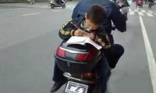 Homework, Chinese style: Youngster puts school run to good use as he ...