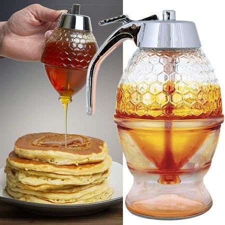 A Person Pouring Syrup Onto Pancakes On A Plate With Honey In A Glass