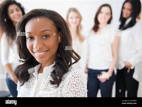 Woman smiling with friends Stock Photo - Alamy