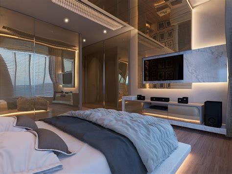 A Bedroom With A Large Bed And A Flat Screen Tv Mounted On The Wall