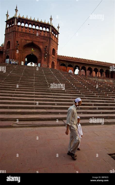 Muslim Father And Son At The Friday Mosque Or Jama Masjid In Old Delhi