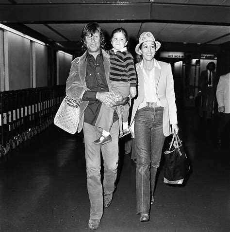 Kris Kristofferson And Rita Coolidge At Lap With Their